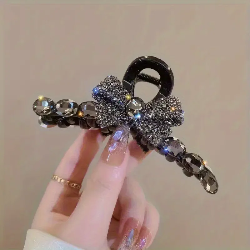 Elegant large acrylic bow hair clip with sparkling rhinestones - a fashionable solid color accessory for women and girls
