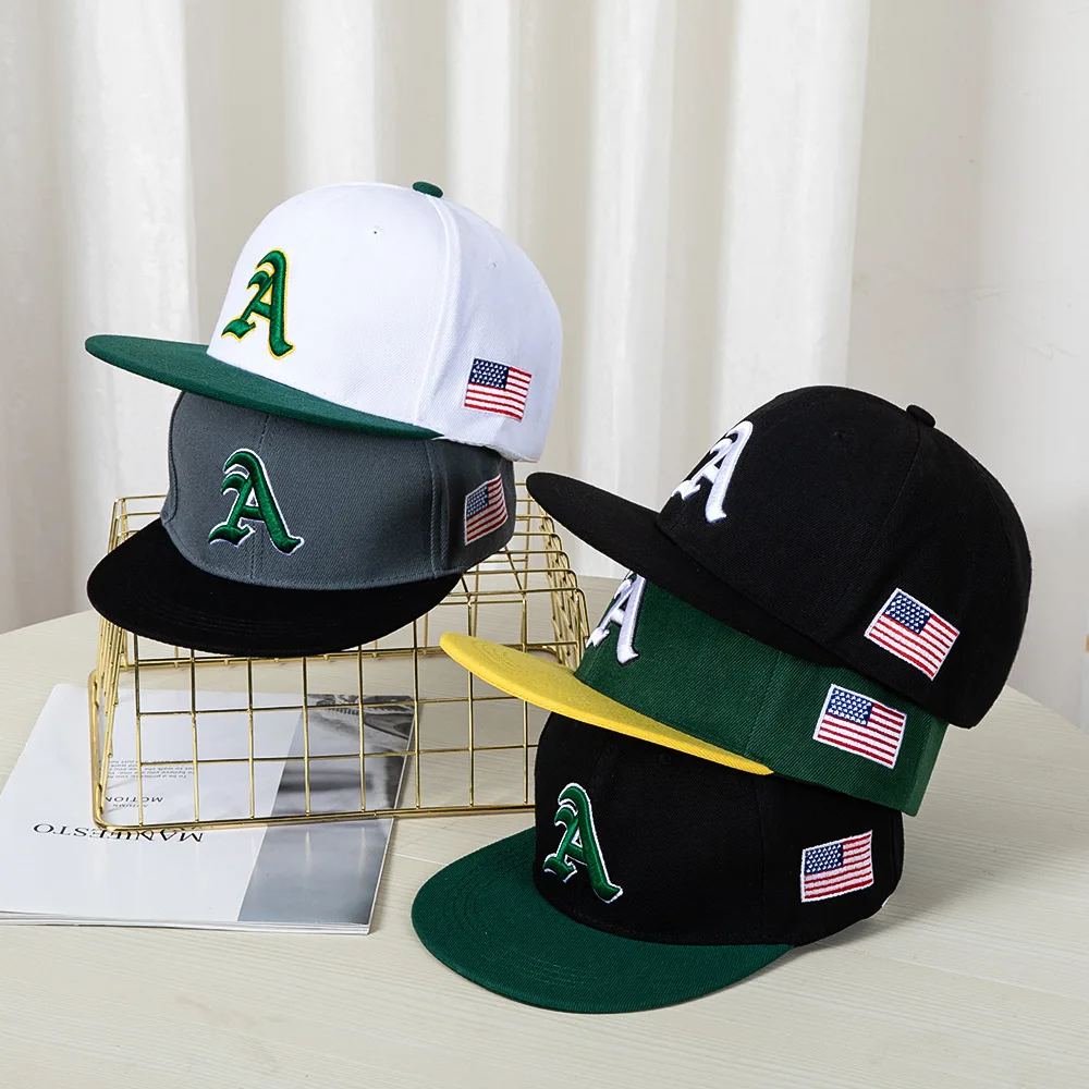 Hip-hop style baseball cap with a flat top, color patching, letter embroidery. Suitable for both women and men