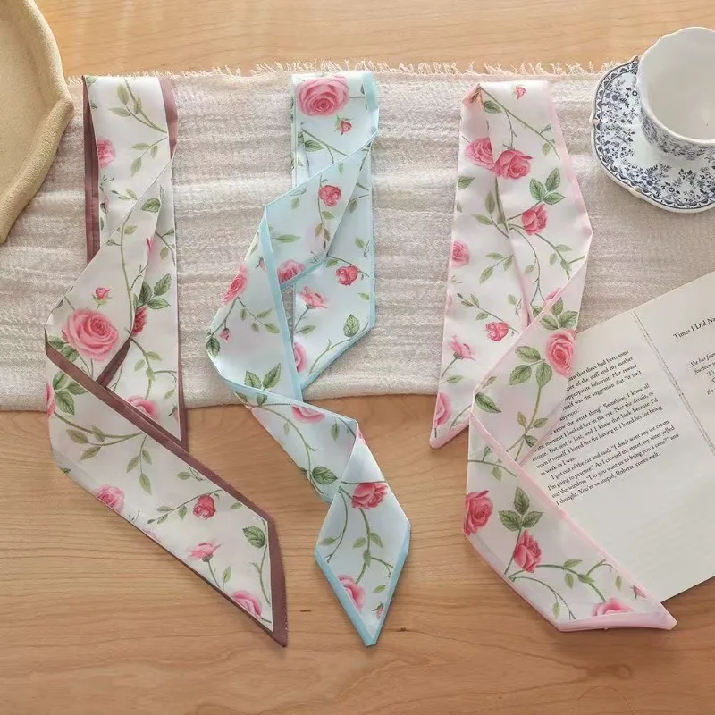 Elegant ladies’ long ribbon scarf with a rose pattern; versatile as a hairband, bag strap or neck scarf; a stylish accessory
