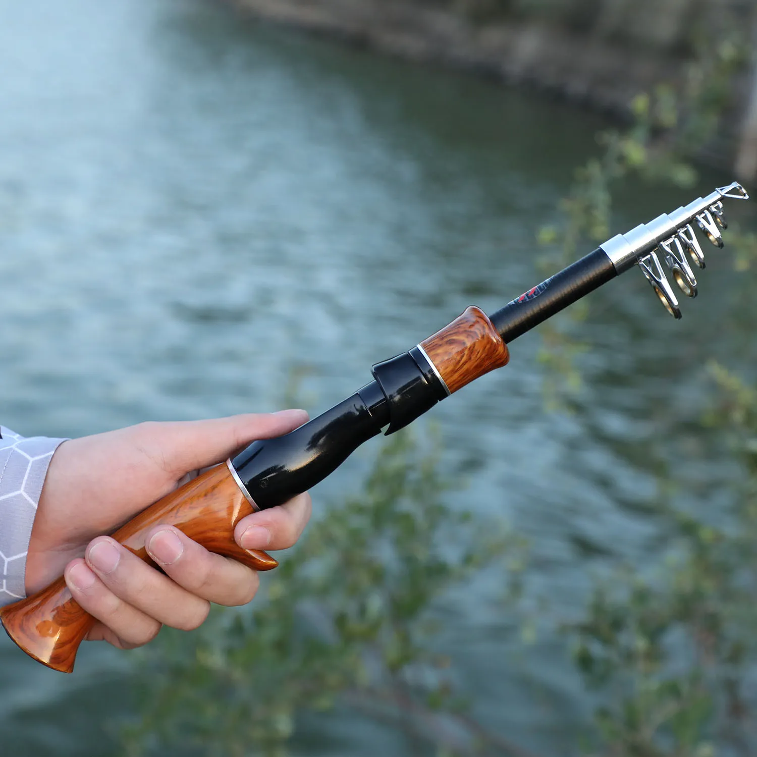 Sougayilang Telescopic Fishing Rod 1.6M Spinning Casting Role Lightweight Portable And Durable Cork Handle Travel Fishing Rod