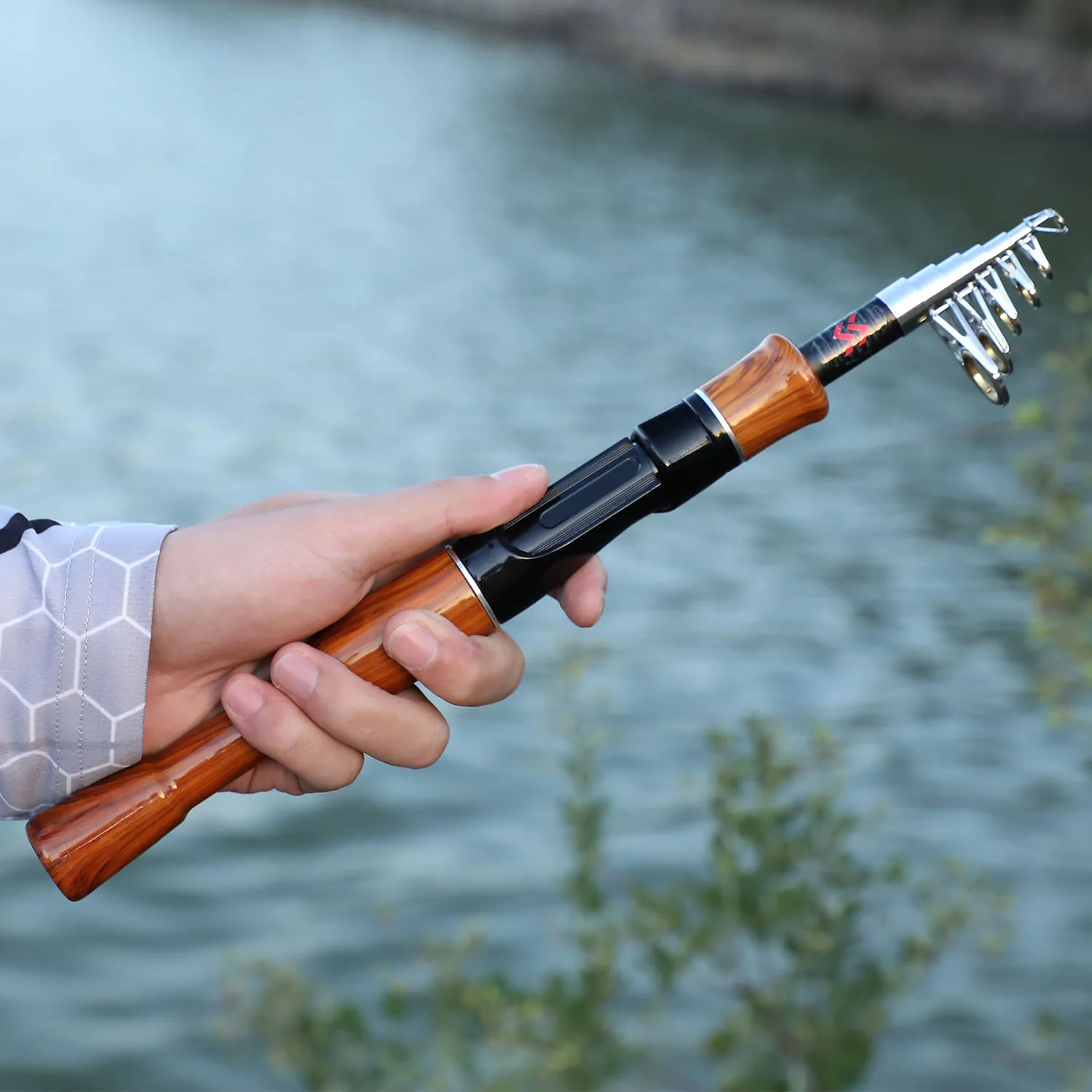 Sougayilang Telescopic Fishing Rod 1.6M Spinning Casting Role Lightweight Portable And Durable Cork Handle Travel Fishing Rod