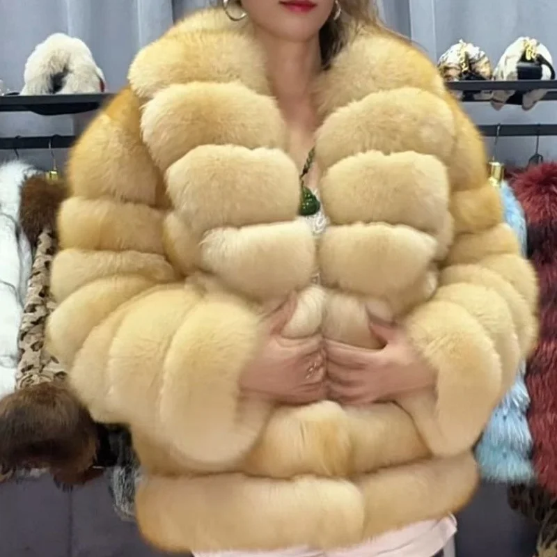 Lady's fashionable warm natural fur coat with a collar for warmth, luxurious high street outerwear
