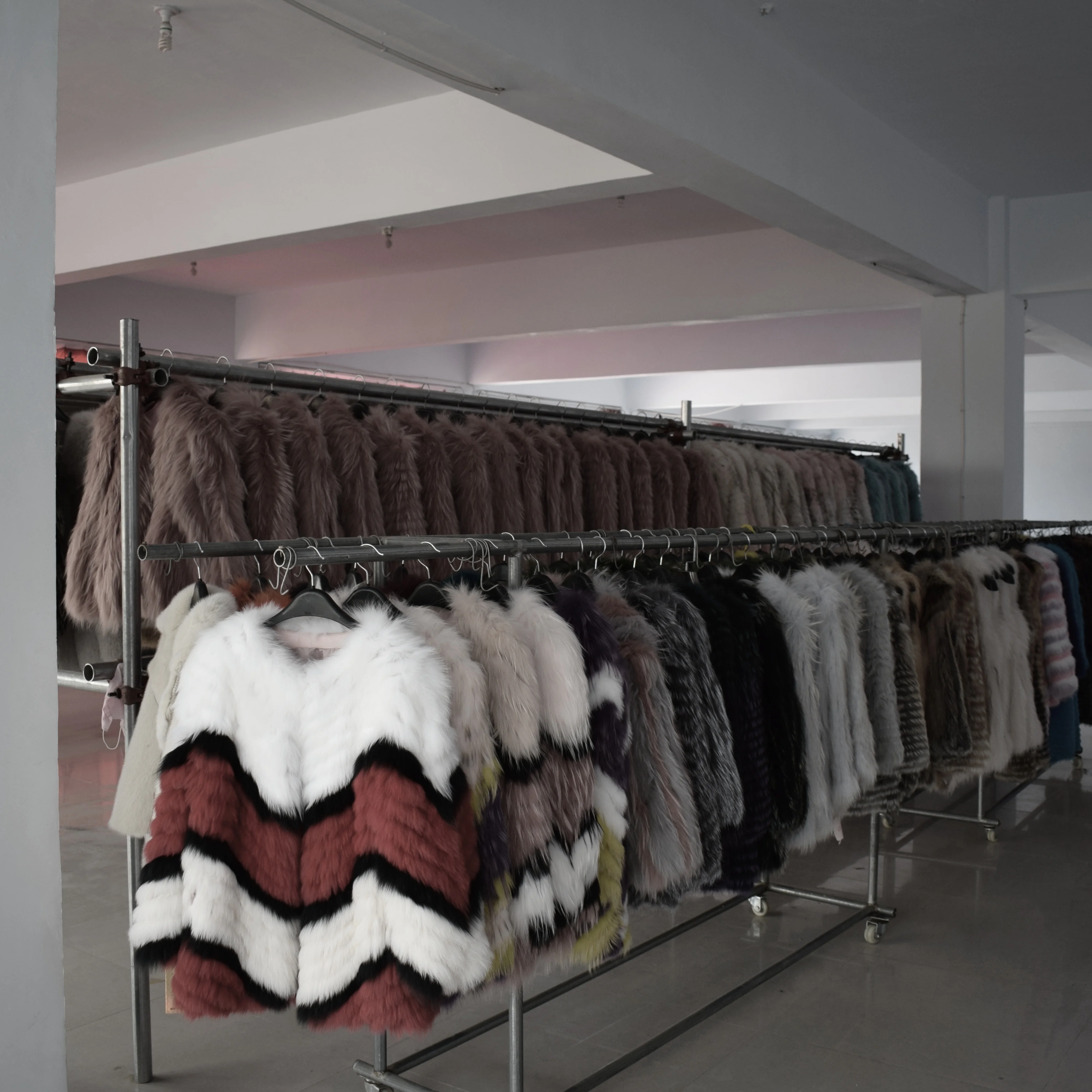 Lady's fashionable warm natural fur coat with a collar for warmth, luxurious high street outerwear