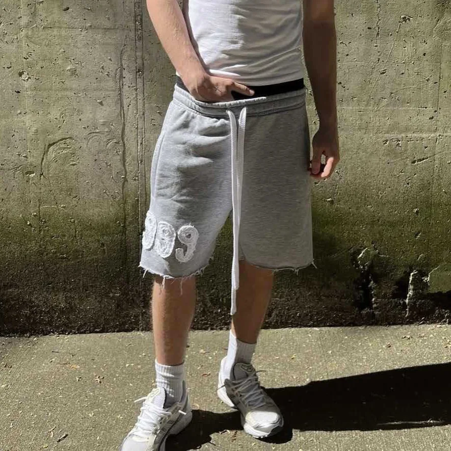 Trendy High Street Trend Loose Casual Personality999 Pattern Embroidery Elastic Waist Lace Up Sports five quarter Pants Men Wom