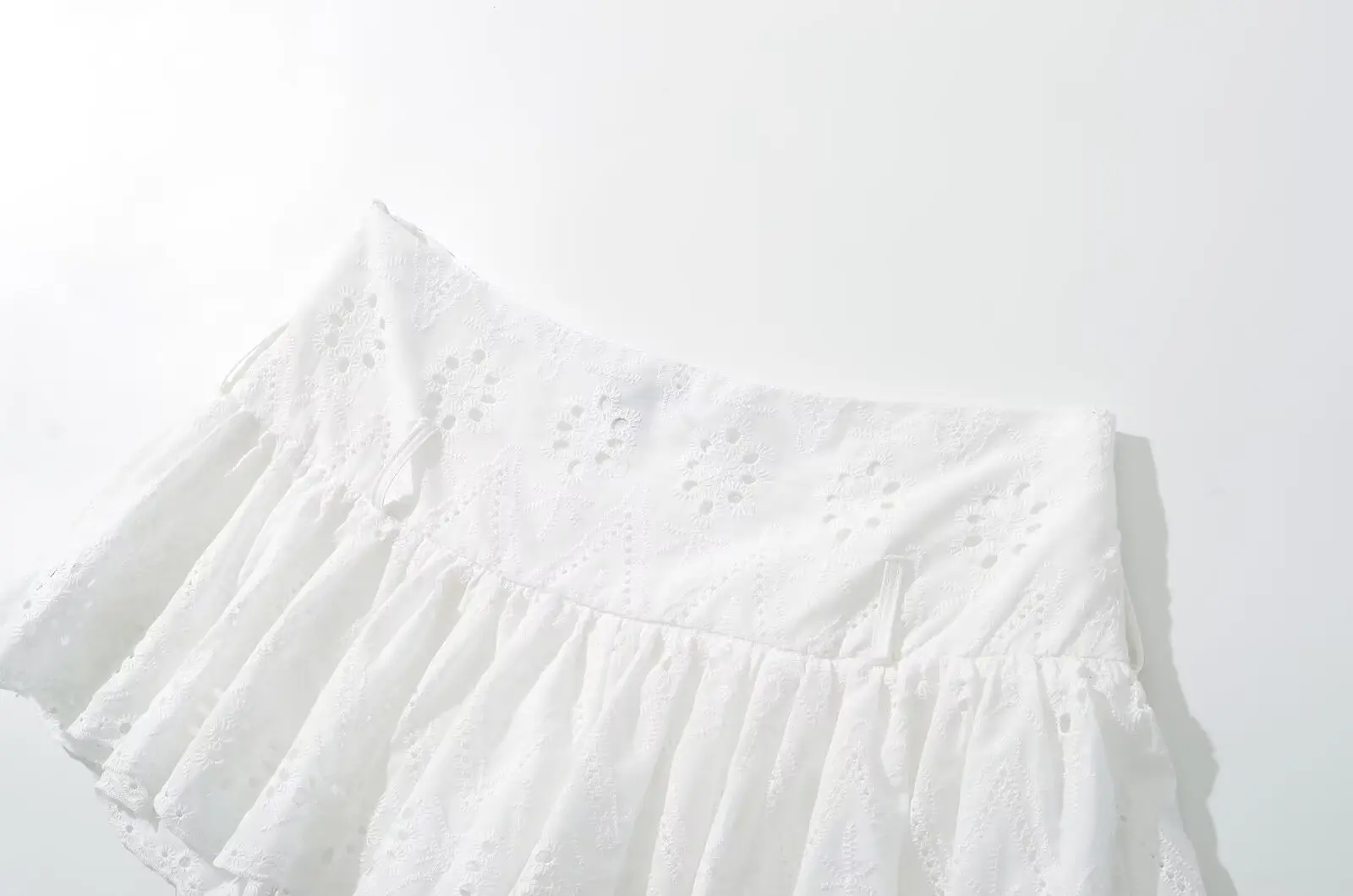 YENKYE Cool Girl Hollow Out Embroidery White Mini Skirt For Women Sexy Low Waist Summer Skirts With Shorts Lining