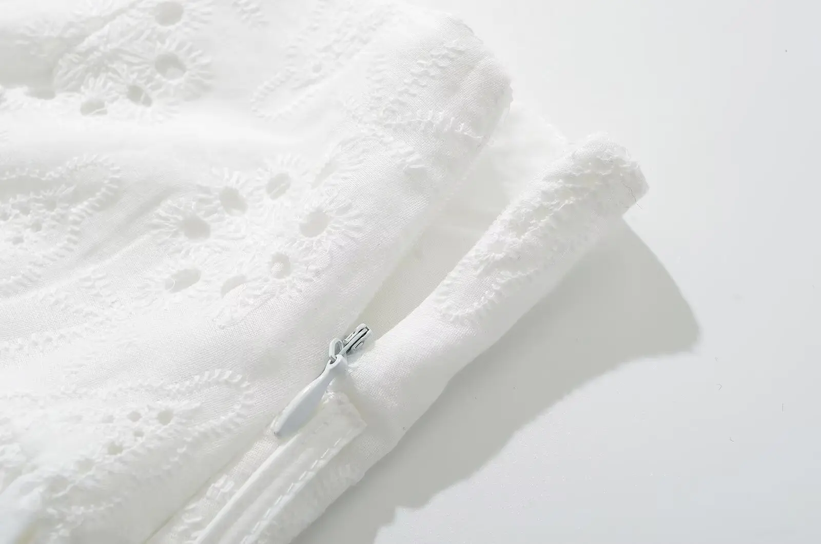 YENKYE Cool Girl Hollow Out Embroidery White Mini Skirt For Women Sexy Low Waist Summer Skirts With Shorts Lining