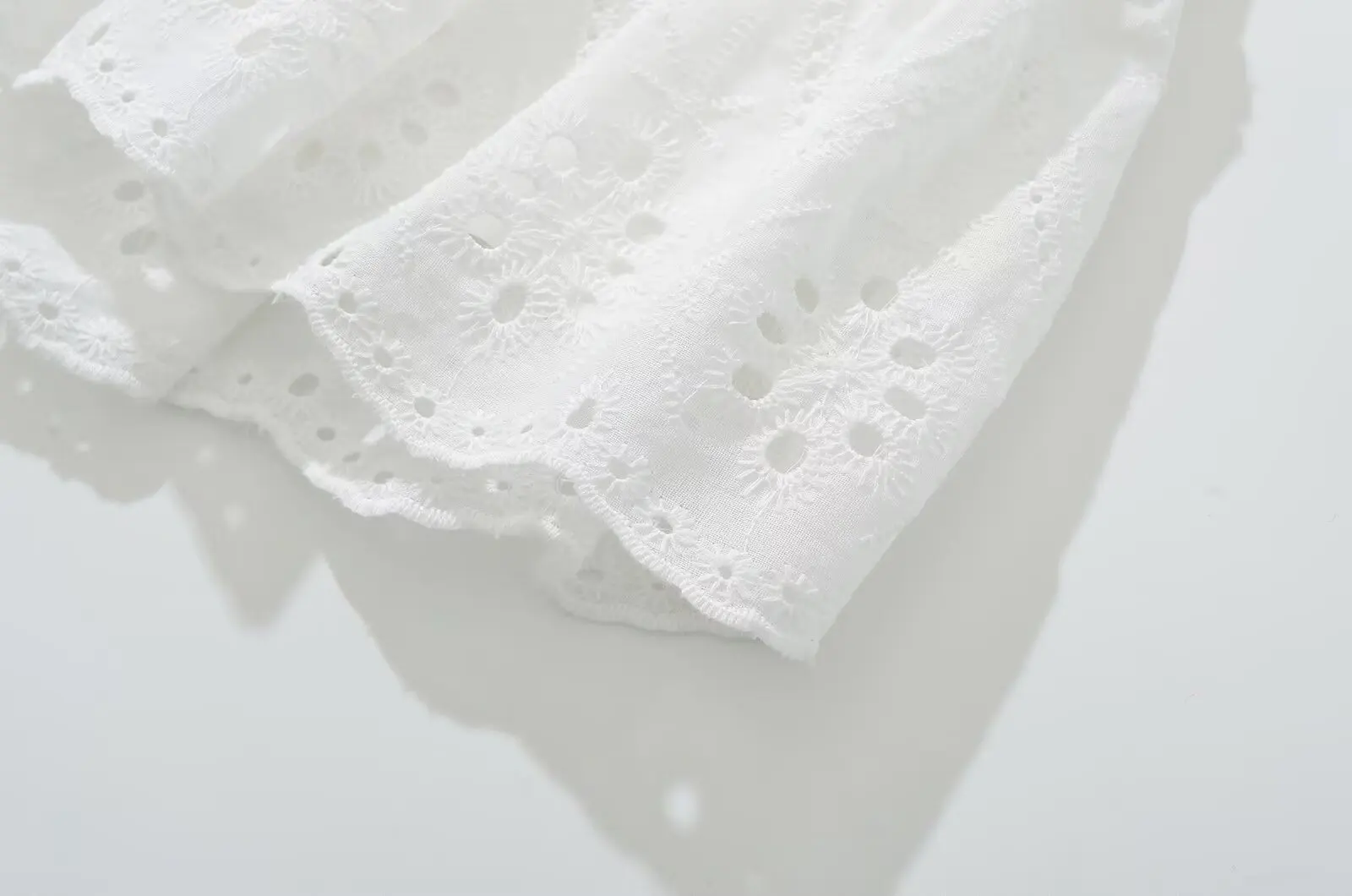 YENKYE Cool Girl Hollow Out Embroidery White Mini Skirt For Women Sexy Low Waist Summer Skirts With Shorts Lining