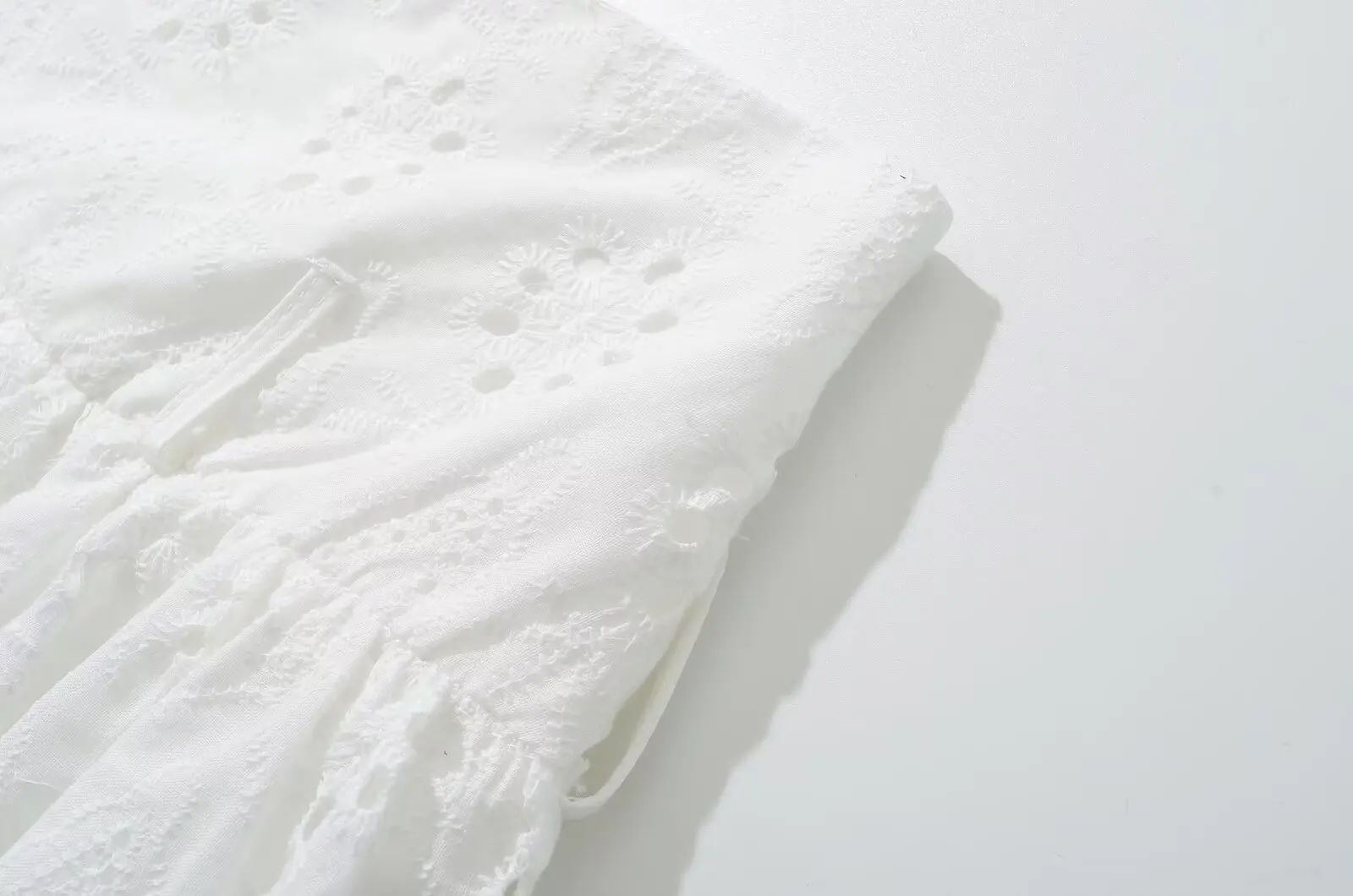 YENKYE Cool Girl Hollow Out Embroidery White Mini Skirt For Women Sexy Low Waist Summer Skirts With Shorts Lining