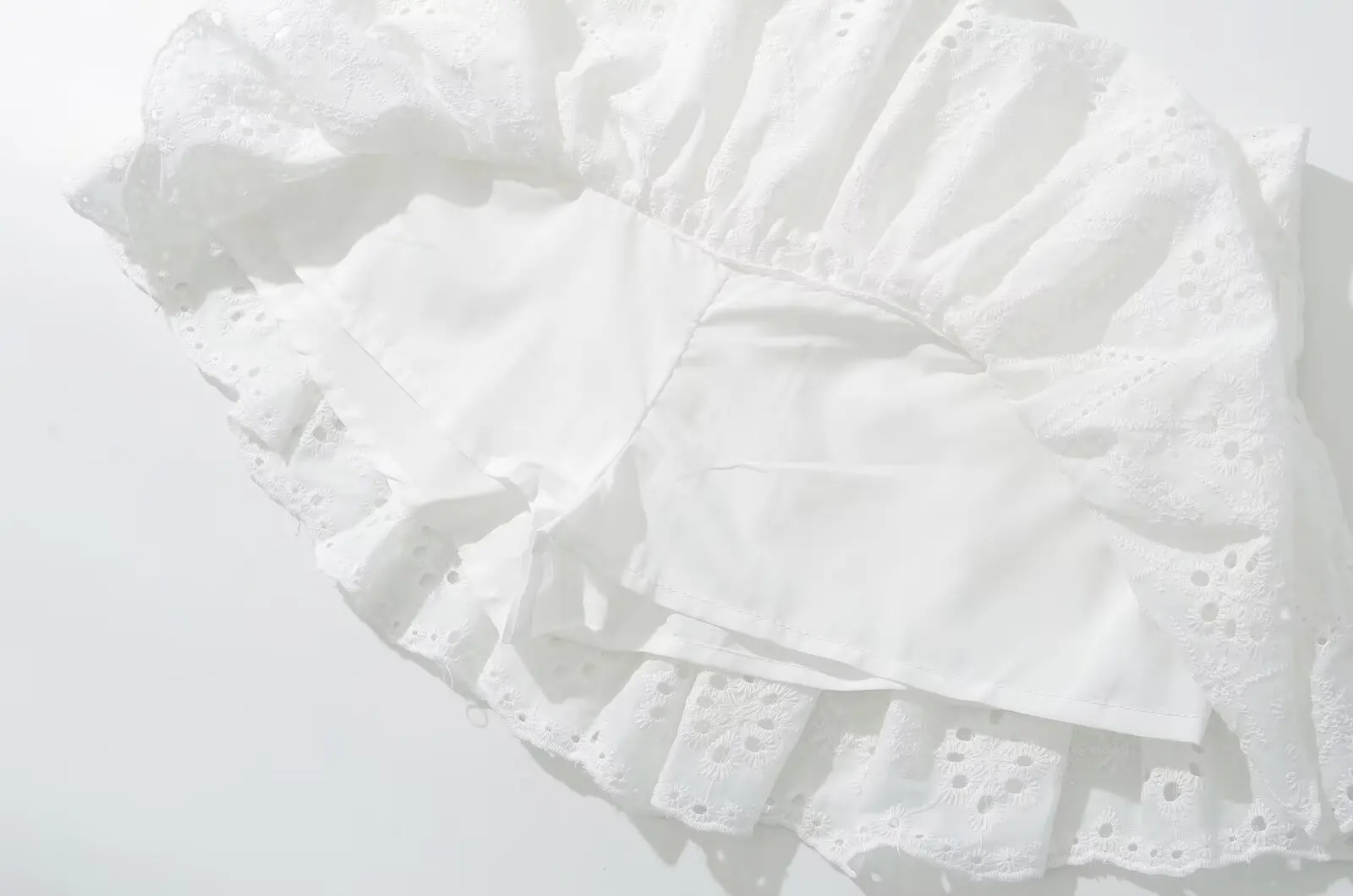 YENKYE Cool Girl Hollow Out Embroidery White Mini Skirt For Women Sexy Low Waist Summer Skirts With Shorts Lining