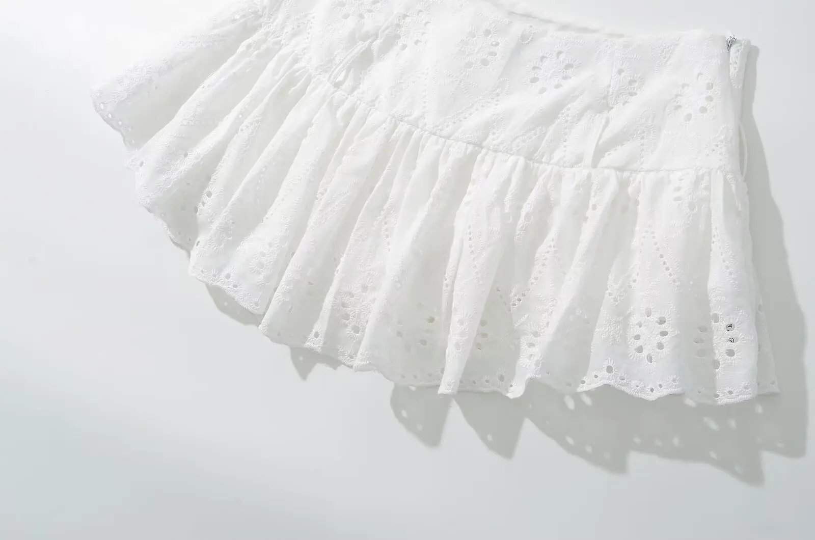 YENKYE Cool Girl Hollow Out Embroidery White Mini Skirt For Women Sexy Low Waist Summer Skirts With Shorts Lining