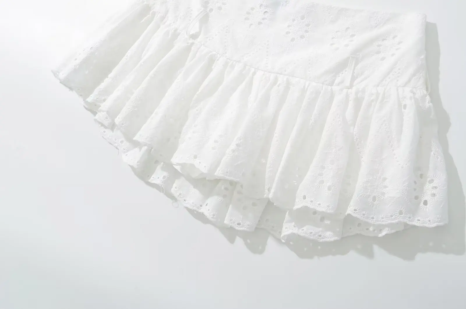 YENKYE Cool Girl Hollow Out Embroidery White Mini Skirt For Women Sexy Low Waist Summer Skirts With Shorts Lining