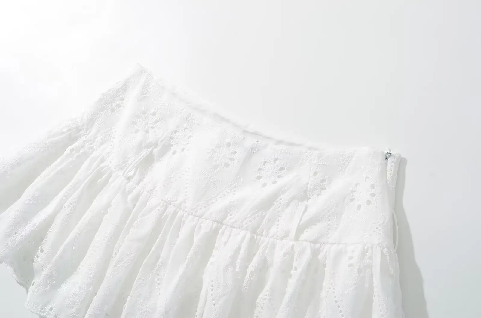 YENKYE Cool Girl Hollow Out Embroidery White Mini Skirt For Women Sexy Low Waist Summer Skirts With Shorts Lining