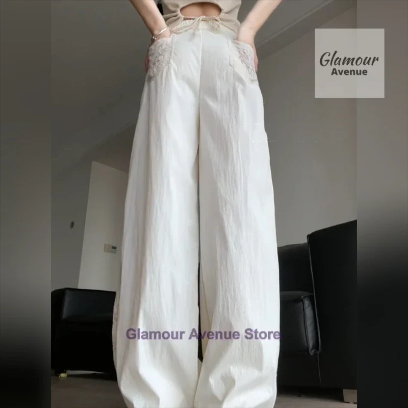 French retro lace design stitching pants women's summer new fashion temperament straight loose wide leg drop casual pants.